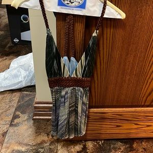 Sleeveless leather trimmed top